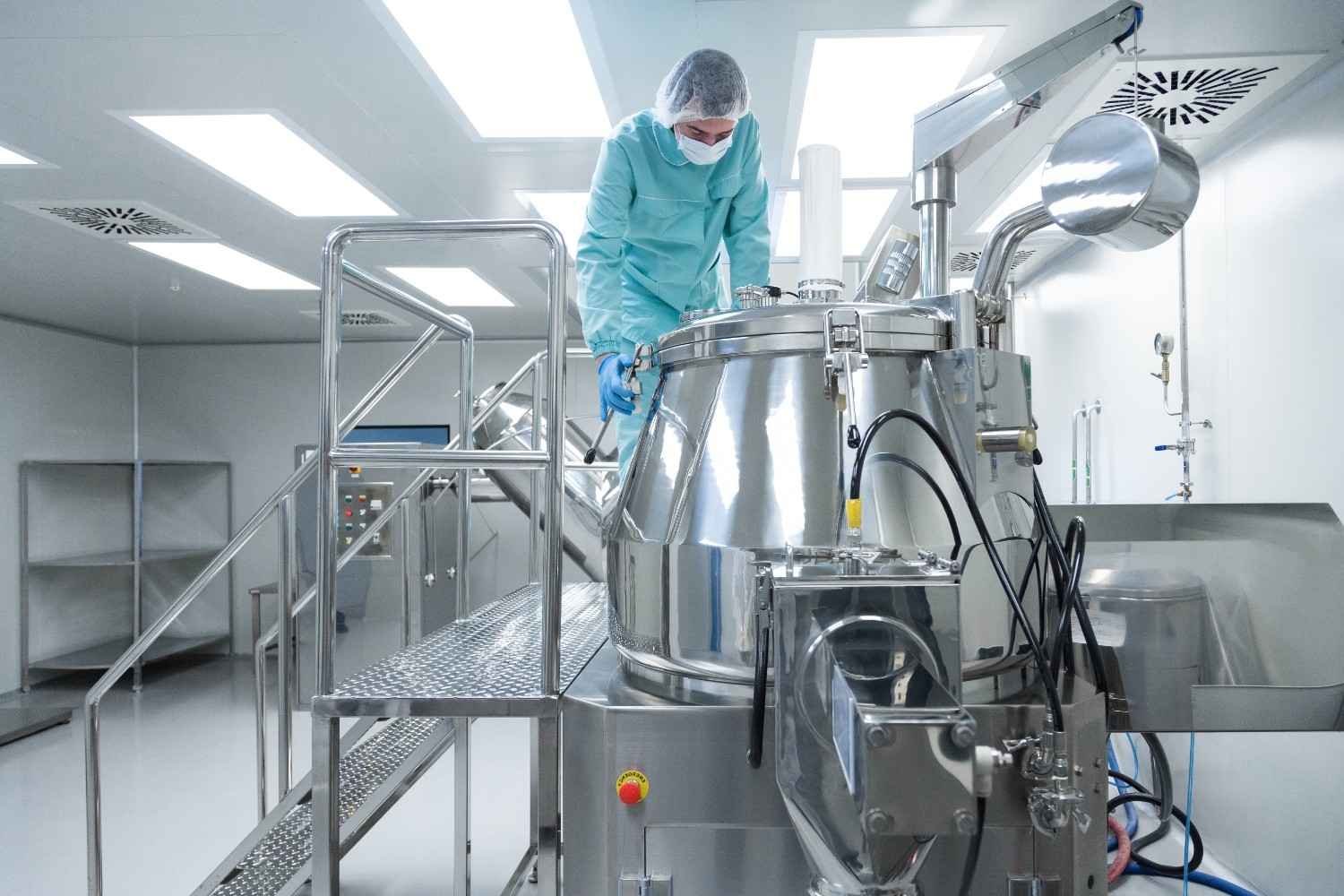 pharmaceutical-factory-man-worker-protective-clothing-operate-production-line-sterile-working-conditions (1)